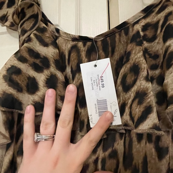 This dress has never been used and still has the tags attached. - Picture 3 of 4